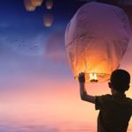 Photo of someone launching a sky lantern