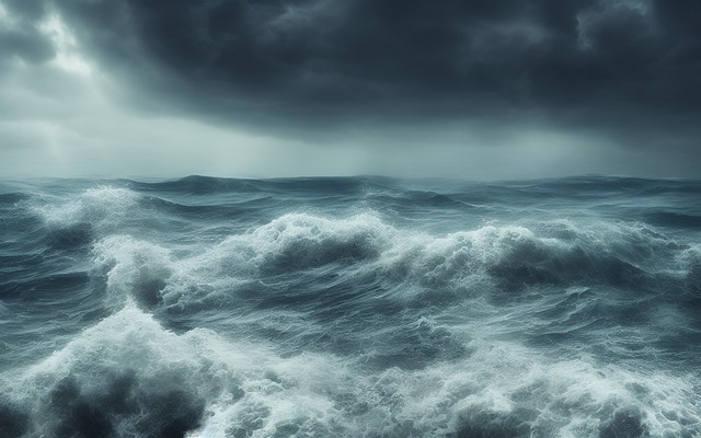 A stormy sea with black clouds and huge waves