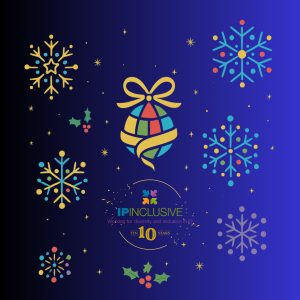 Festive graphic with a dark blue graded background featuring a globe-shaped ornament wrapped in a yellow ribbon and bow, surrounded by colourful snowflakes, stars, holly leaves and berries. Text at the bottom reads: “IP INCLUSIVE – Working for diversity and inclusion in IP – TEN 10 YEARS”.